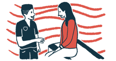 A medical professional talks with a woman seated on an exam table.