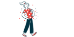 A pregnant woman cradles her belly while walking.