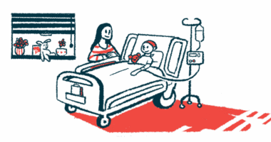 A parent stands alongside the hospital bed of a child seen receiving an infusion therapy.