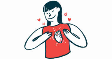 A woman wearing a shirt with a heart on it holds her chest.